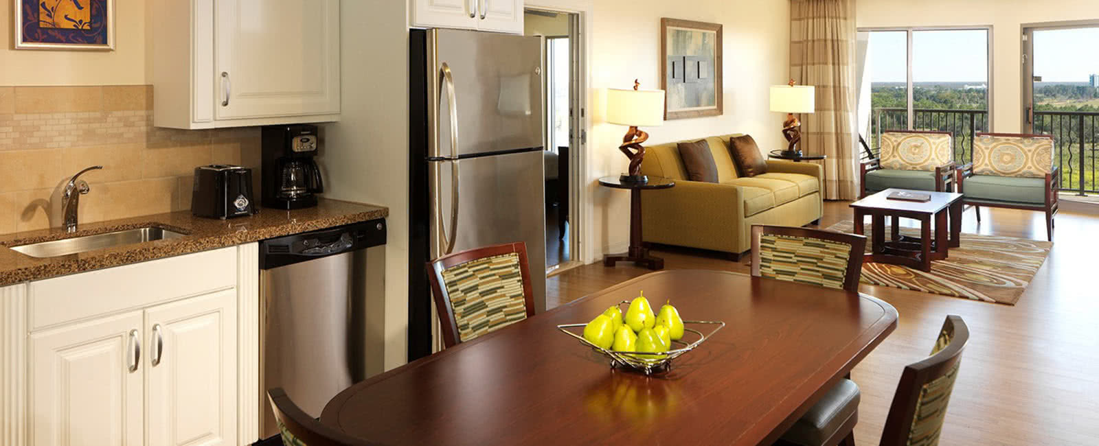 Kitchen, Dining Area, and Living Area at Parc Soleil by Hilton Grand Vacations Club in Orlando, Florida